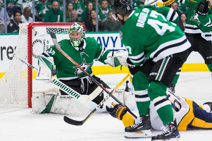 Dallas Stars goaltender Ben Bishop (30) stops a goal attempt by Nashville Predators center...