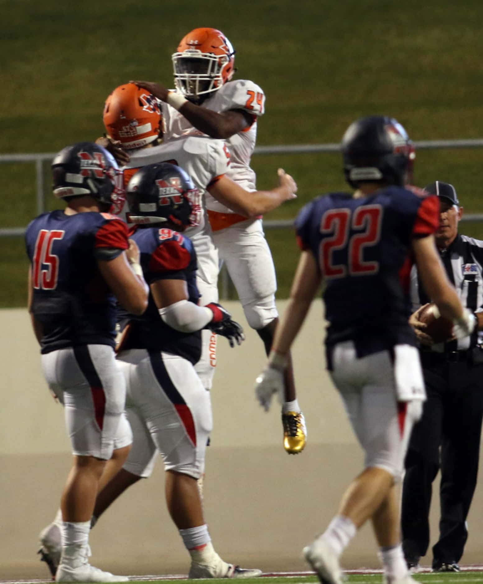 McKinney North running back Lamar Lucas (24) celebrates his rushing touchdown with teammate...