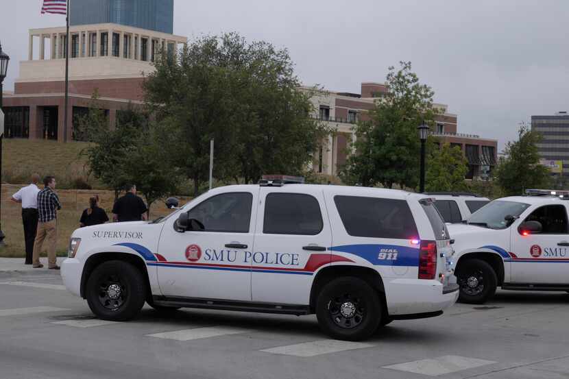 SMU police set up a perimeter after a suspicious package was found at the Bush Center on the...