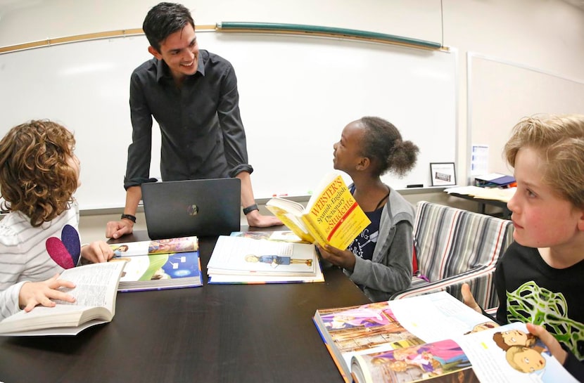 
Fourth-graders Arielle Silver (left), Mariam Jalloh and Caden Richardson work with teacher...