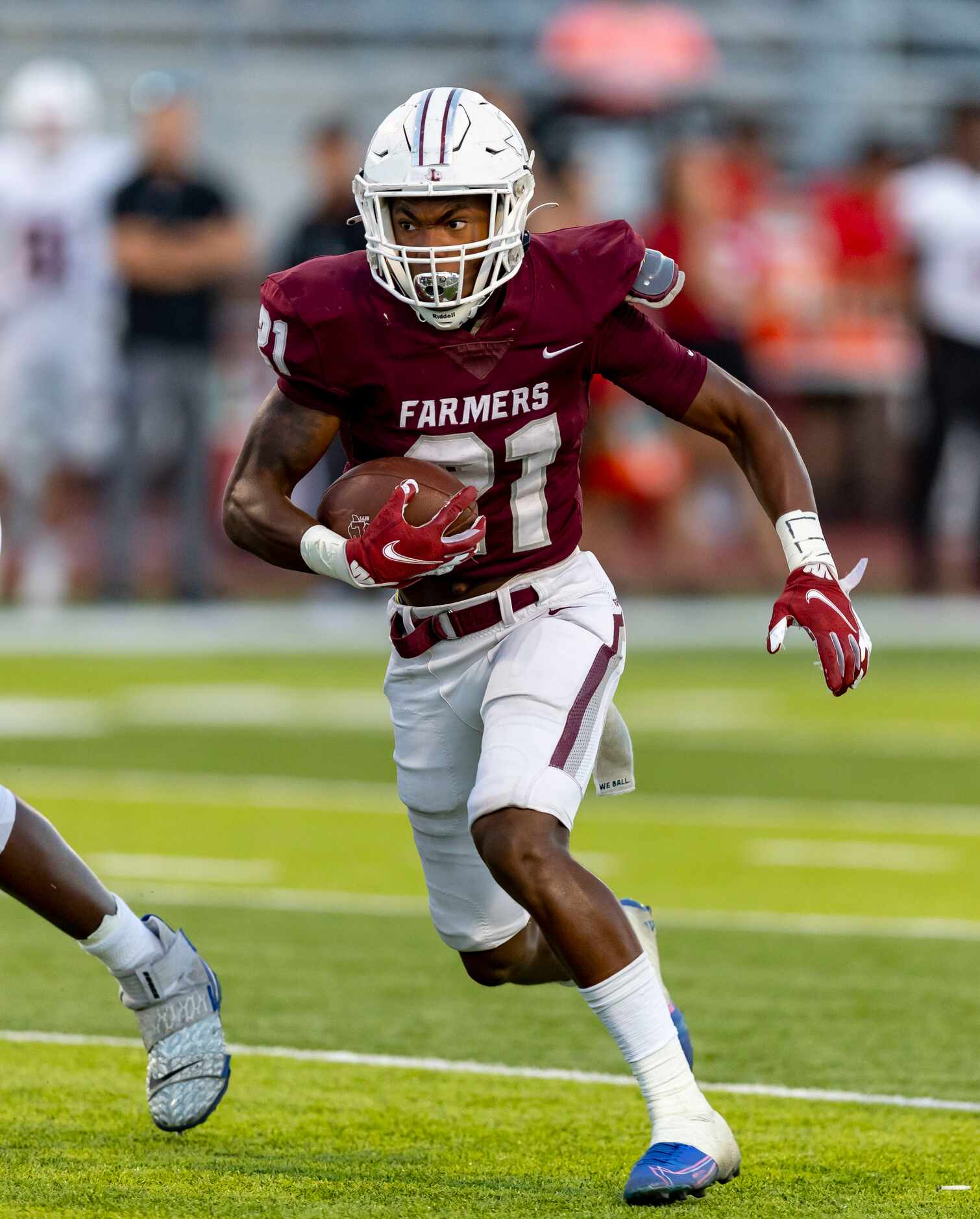 Lewisville junior running back Viron Ellison (21) carries the ball during the first half of...