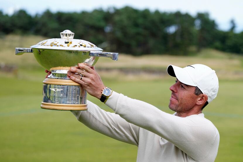 Northern Ireland's Rory McIlroy lifts the trophy following day four of the Genesis Scottish...