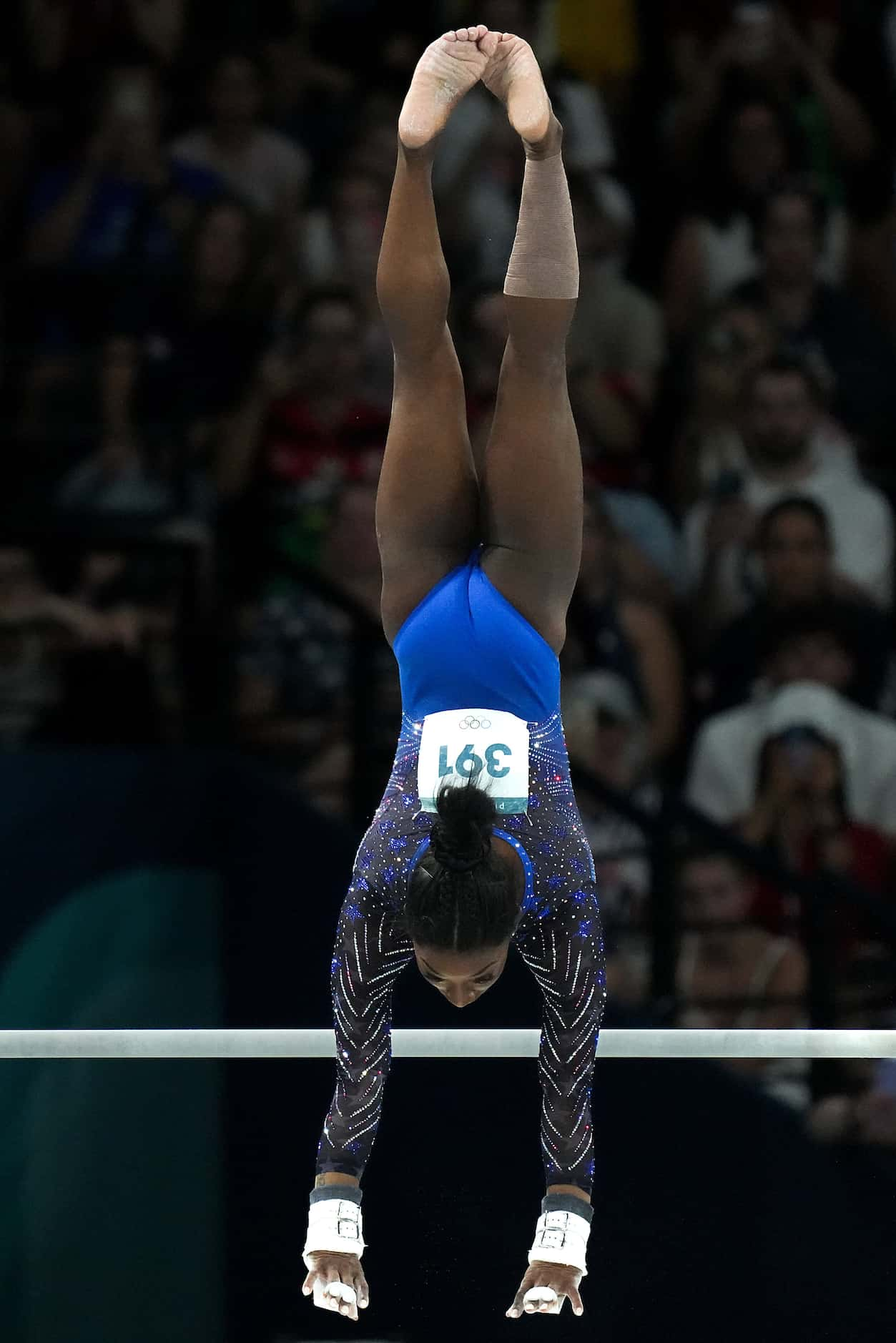 Simone Biles of the United States competes on the uneven bars during the women’s gymnastics...