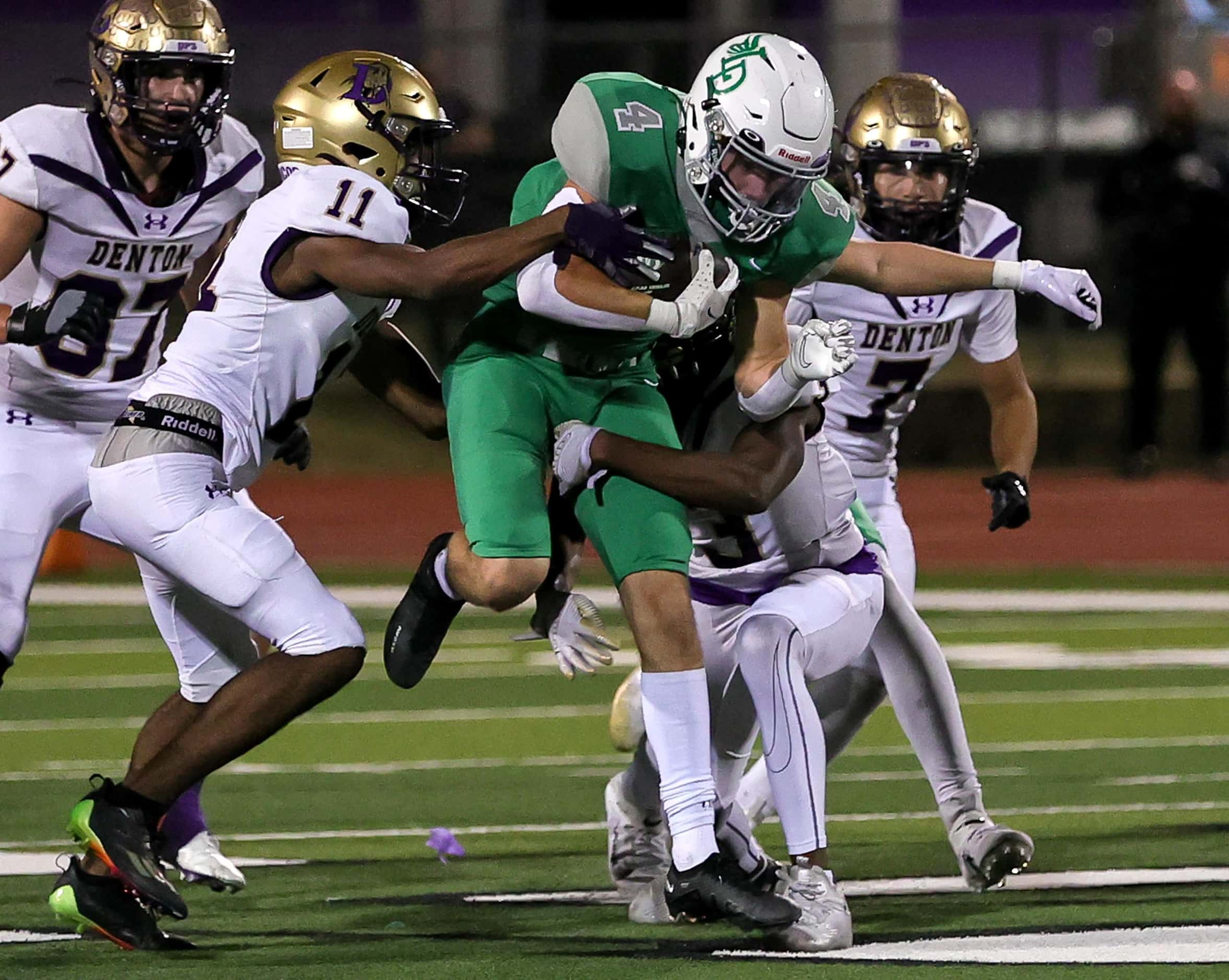 Lake Dallas running back Dylan Brauchle (4) breaks free for a big gain against Denton safety...