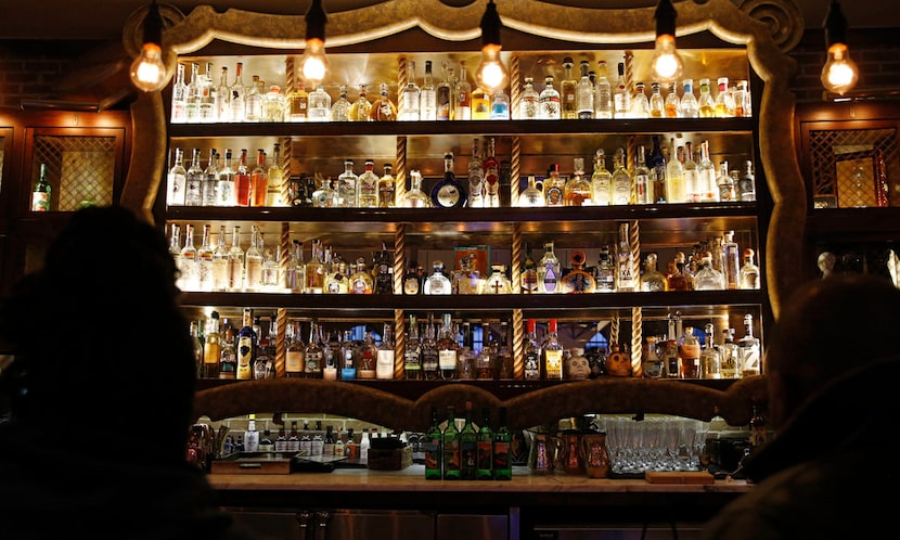 The center section of the bar at Mexican Sugar in Plano features many different types of...