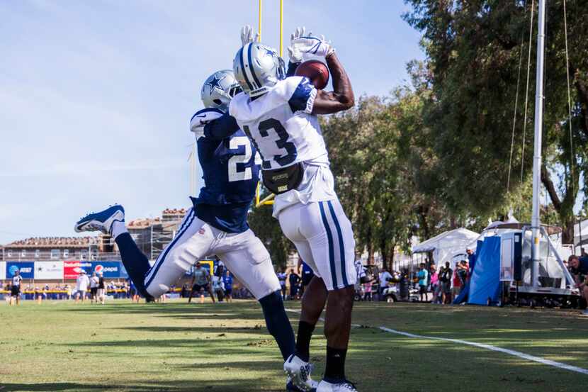 Dallas Cowboys wide receiver Michael Gallup (13) catches a pass ahead of cornerback Chidobe...