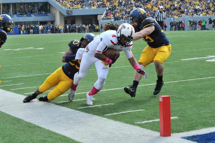 Oct 19, 2013; Morgantown, WV, USA; Texas Tech Red Raiders Bradley Marquez (4) runs to the...