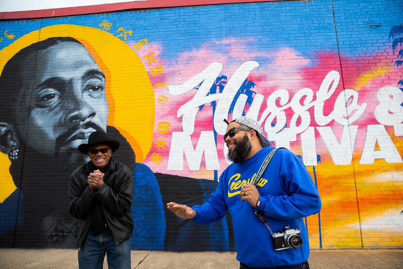 Glendale Shopping Center owner Al Herron (left) shares a laugh while talking to artist...