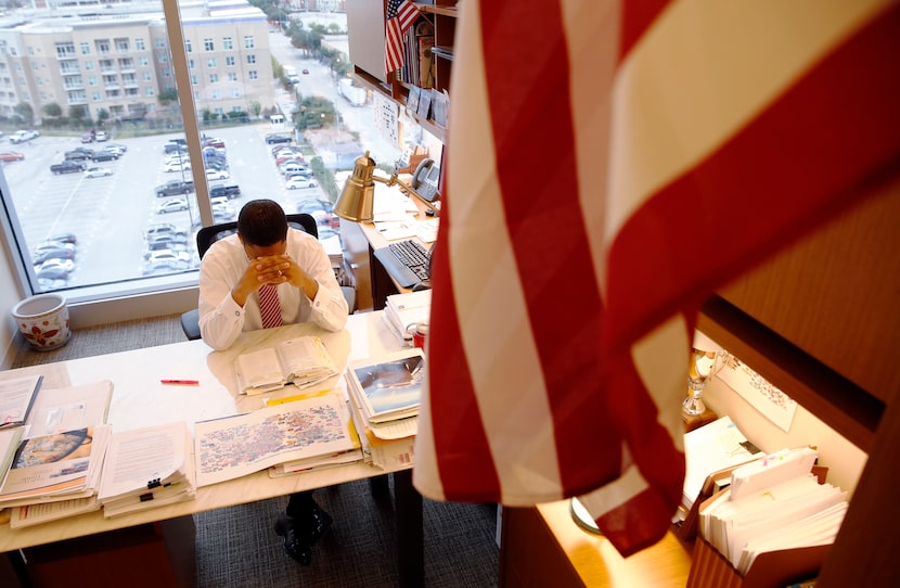 James Waters reads his daily devotional in his office in downtown Dallas. (Vernon...