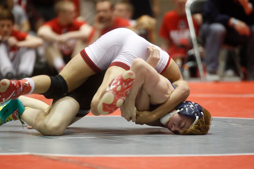 Colton Williams, bottom, of Hebron High School, defeated Howard Smith, of Allen, in the 113...