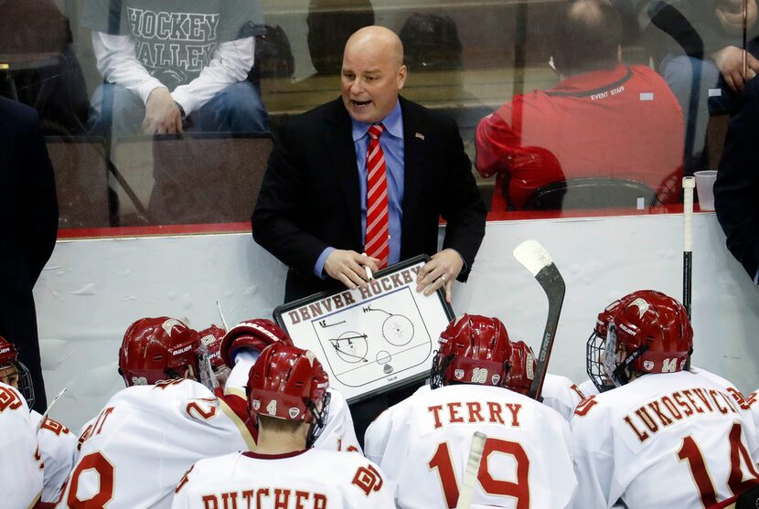 FILE - In this March 26, 2017, file photo, Denver head coach Jim Montgomery directs his...