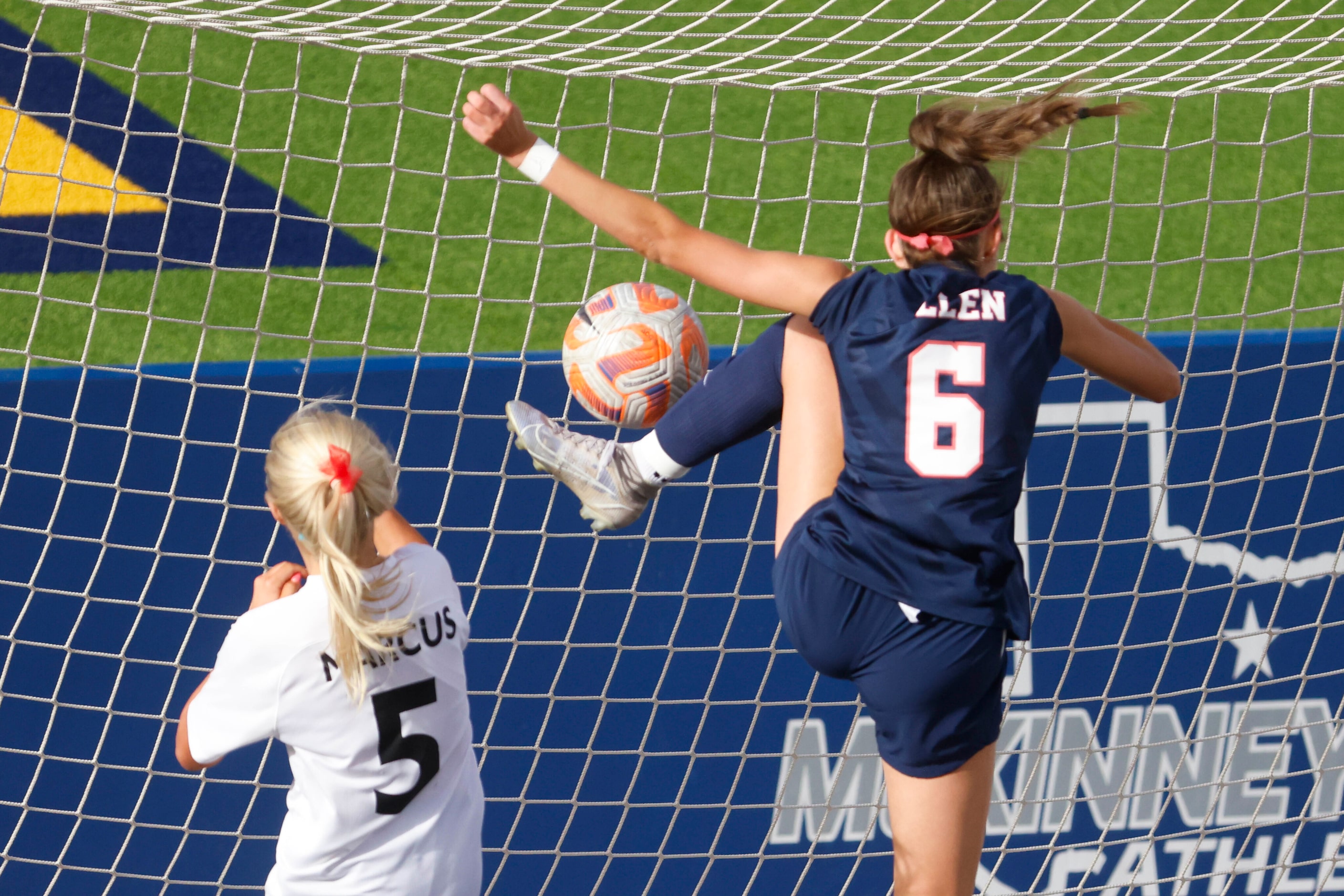 Allen’s Sutton Markee (right) attempts to advance the ball inside the net past Marcus’...