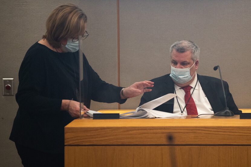 Lead prosecutor Jennifer Balido talks to Dallas police Officer Corey Parker, with the DPD...