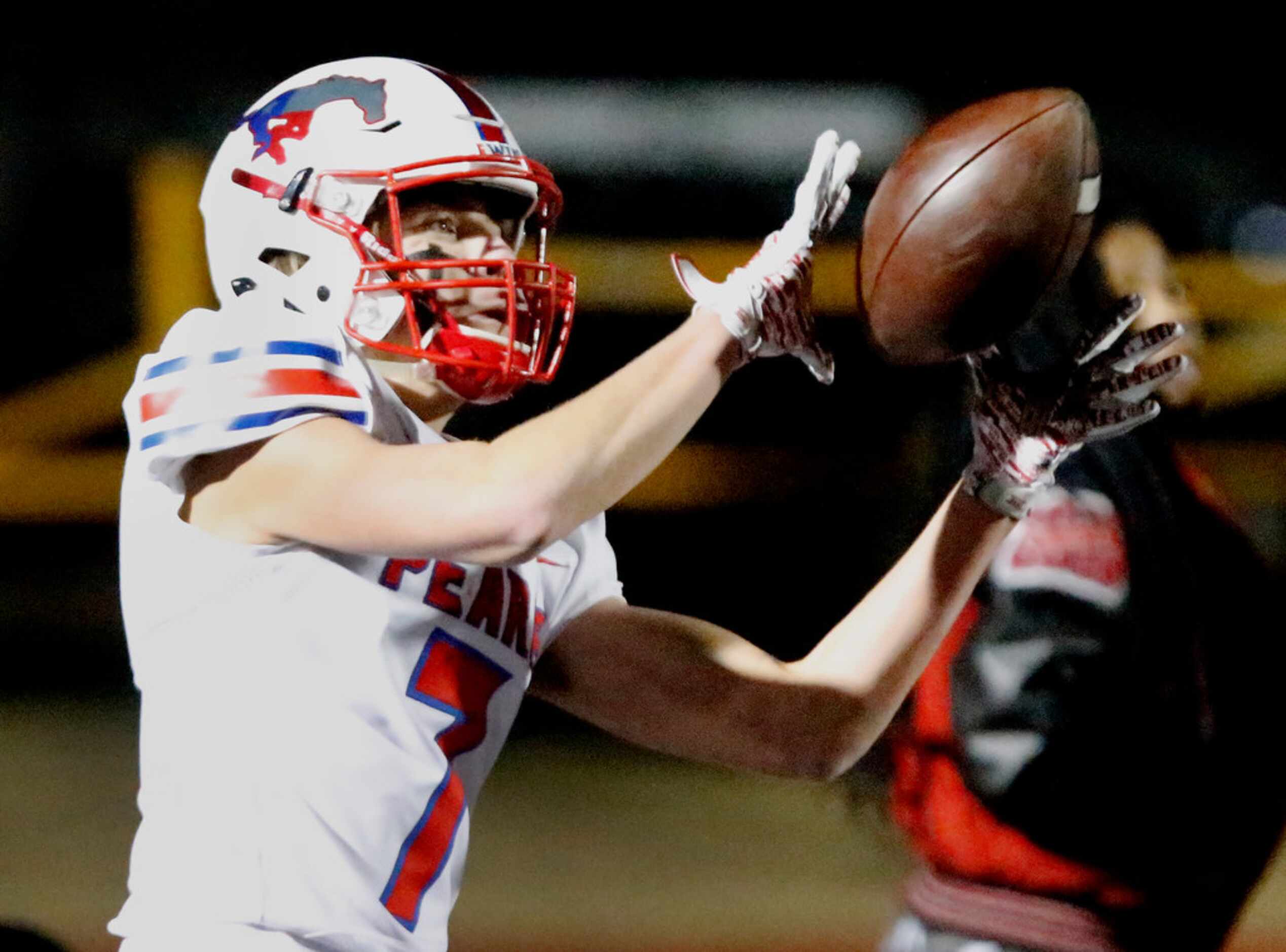 Pearce High School wide receiver Jackson Black (7) caches a two point conversion during the...