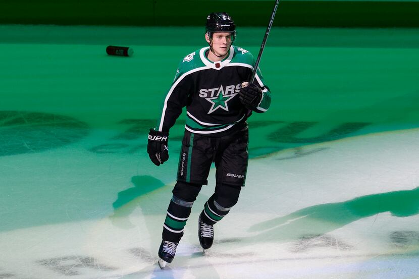 Dallas Stars defenseman Nils Lundkvist (5) salutes the crowd as one of the game's three...