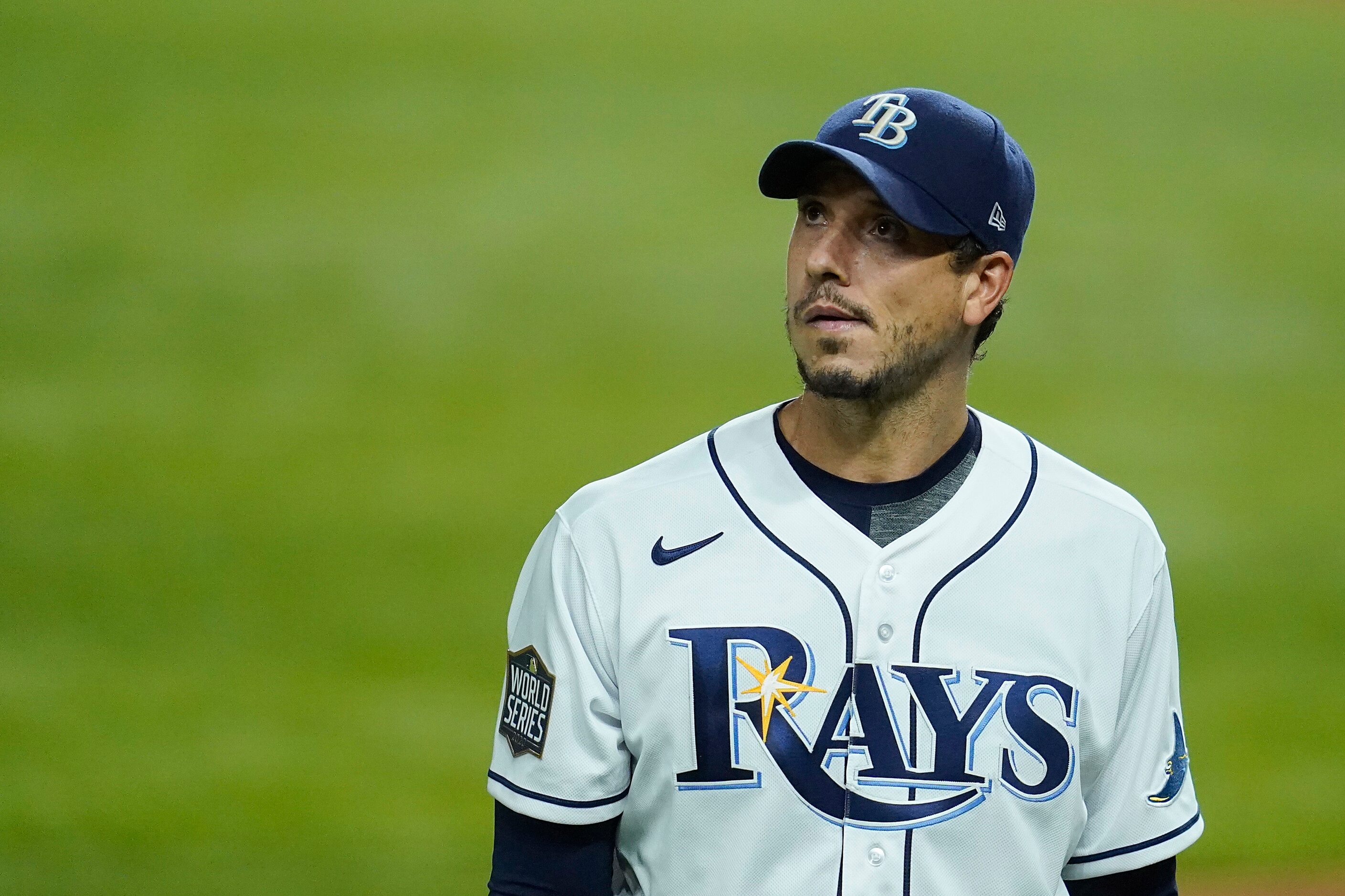 Tampa Bay Rays starting pitcher Charlie Morton looks up as he heads to the dugout after...