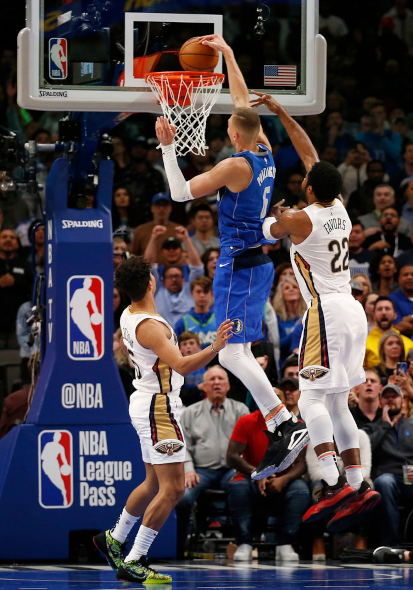 Dallas Mavericks forward Kristaps Porzingis (6) dunks the ball in between New Orleans...