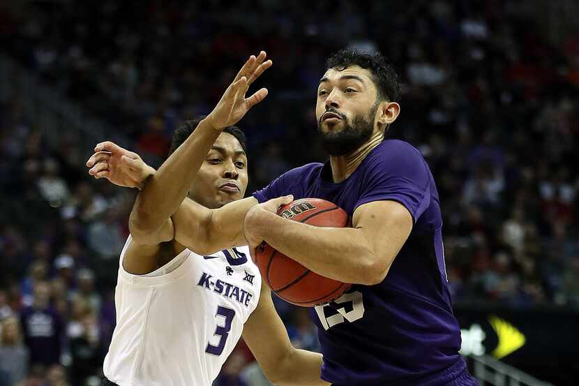 KANSAS CITY, MISSOURI - MARCH 14:  Alex Robinson #25 of the TCU Horned Frogs controls the...