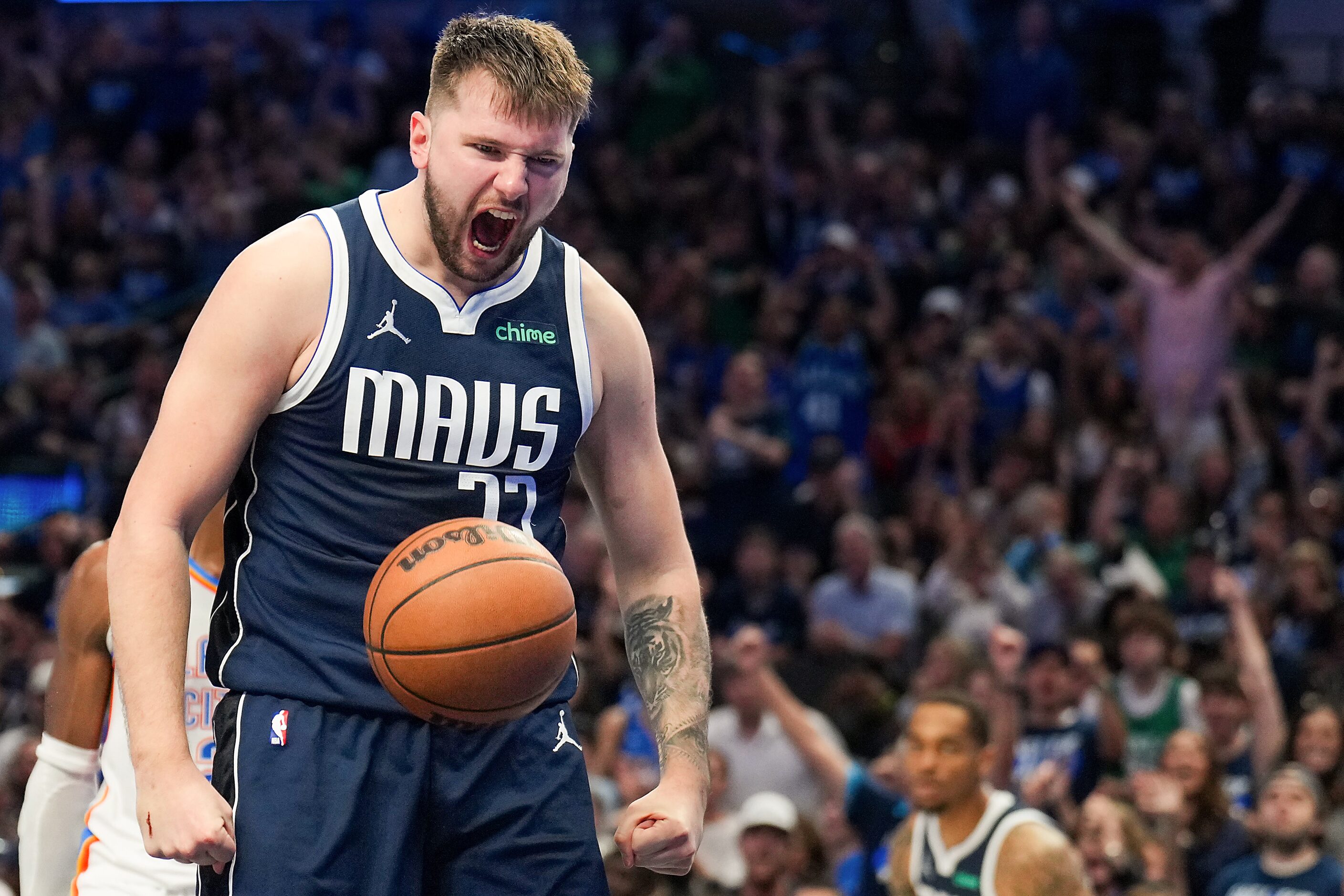 Dallas Mavericks guard Luka Doncic celebrates after scoring while being fouled during the...