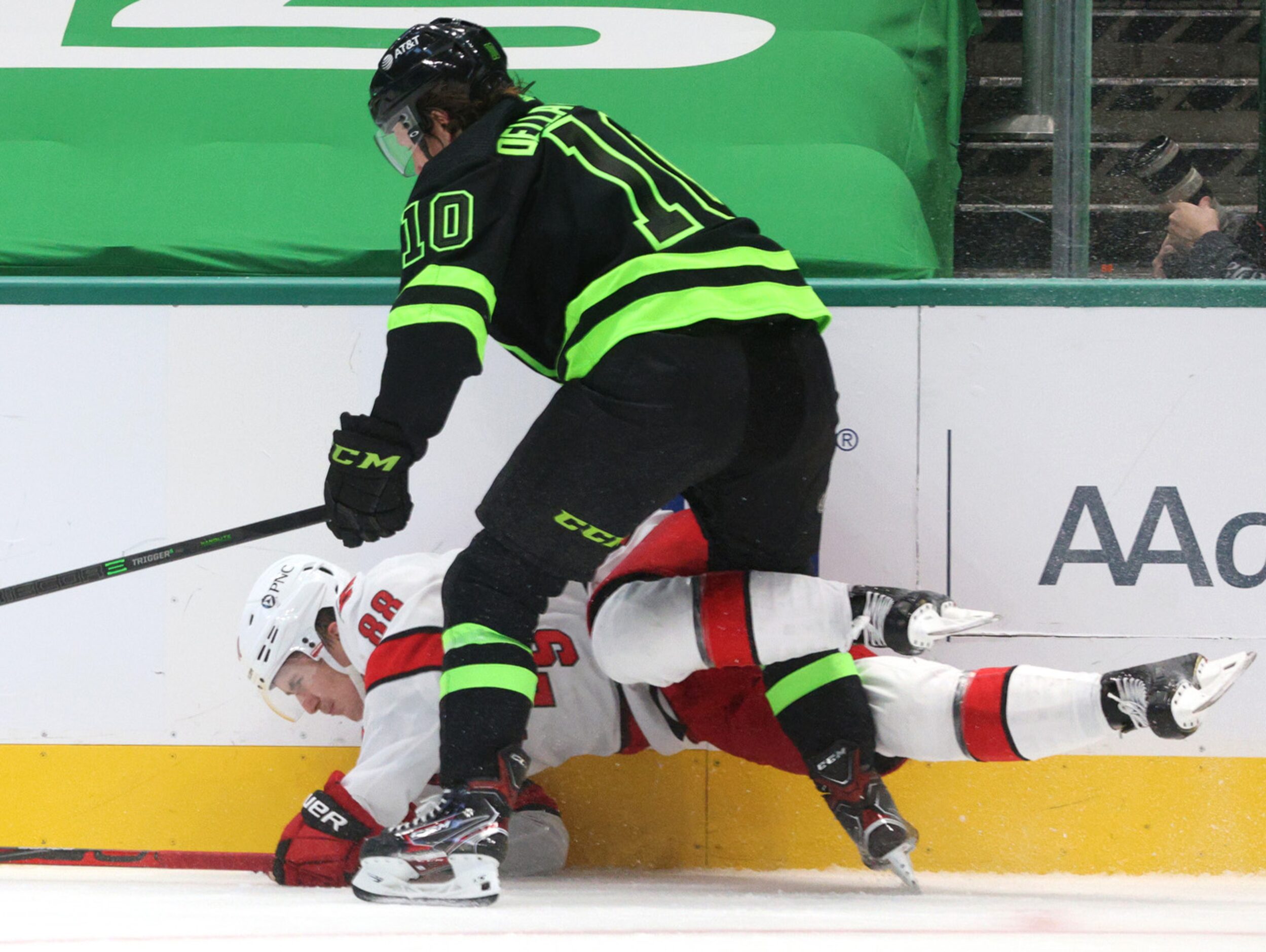 Dallas Stars center Ty Dellandrea (10) pins Carolina Hurricanes center Martin Necas (88)...