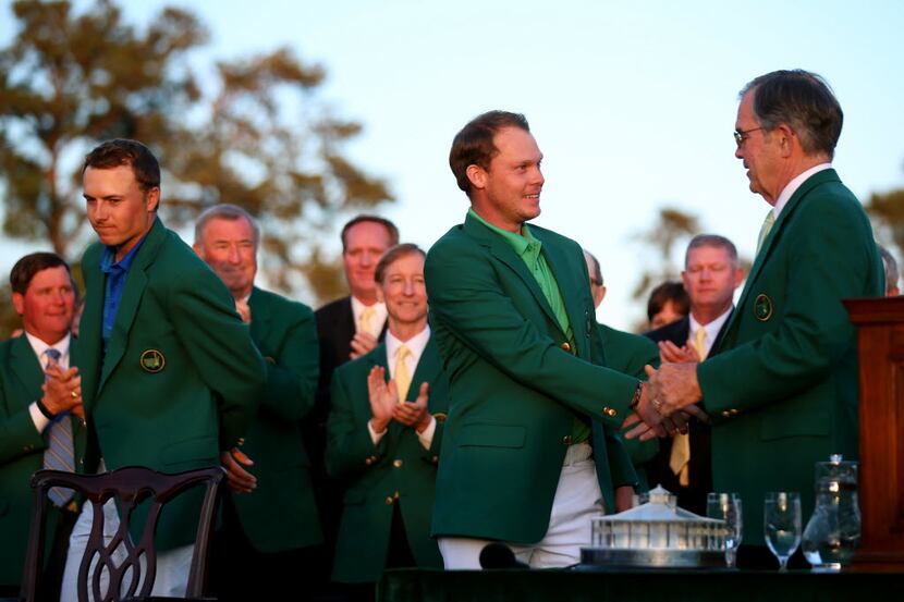 AUGUSTA, GEORGIA - APRIL 10:  Danny Willett of England shakes hands with Chairman of Augusta...