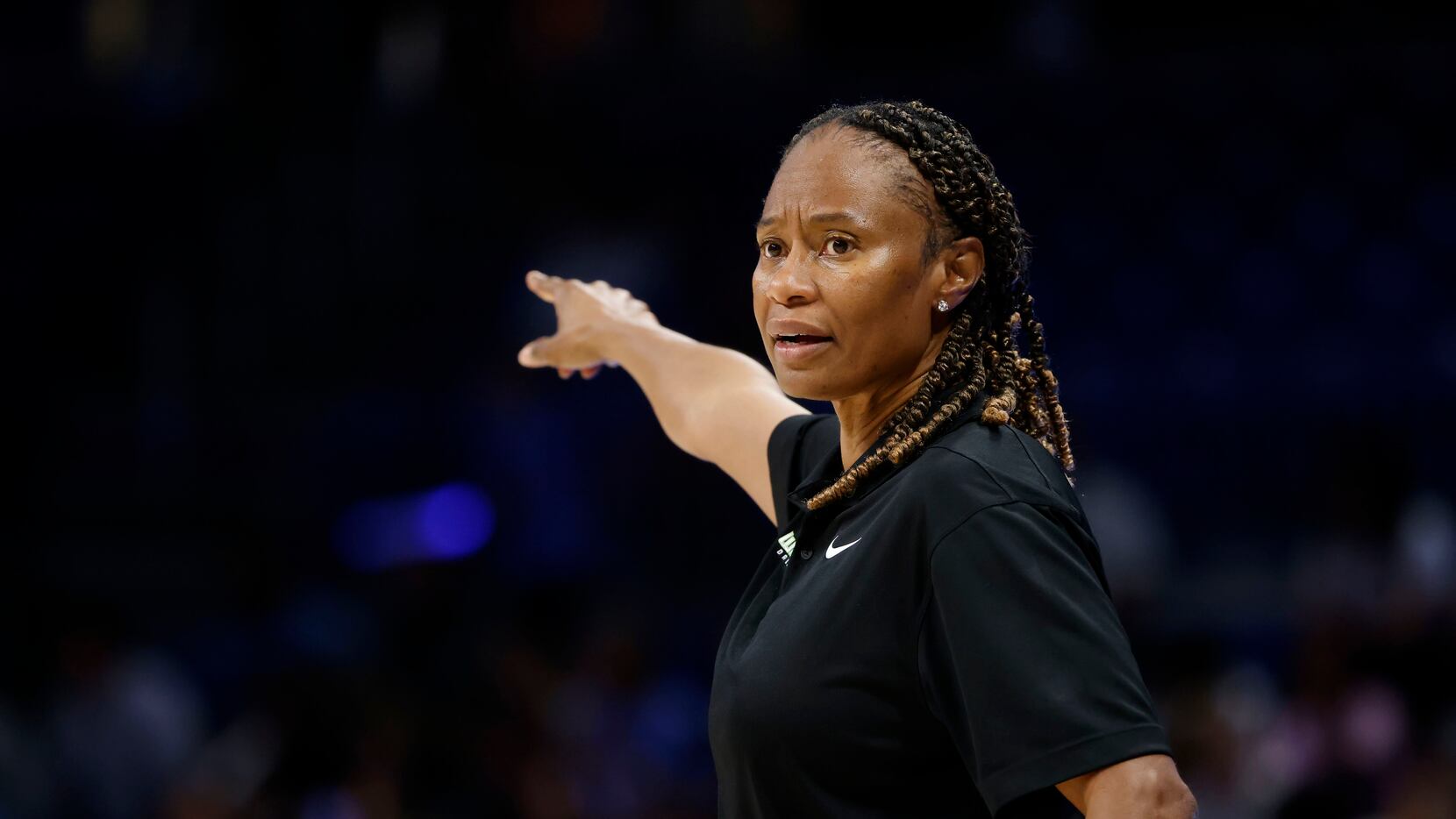 Dallas Wings head coach Vickie Johnson directs her team as they played the New York Liberty...