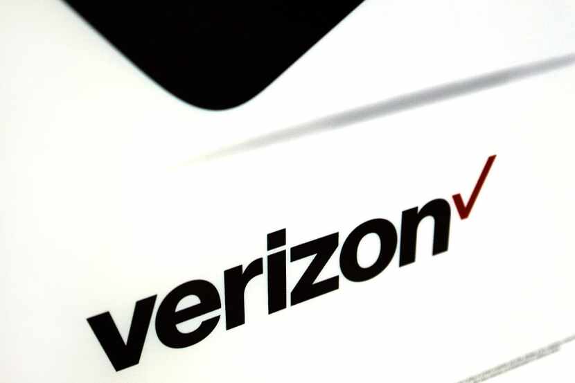 FILE - This Monday, July 25, 2016, file photo shows signage in a Verizon store in North...