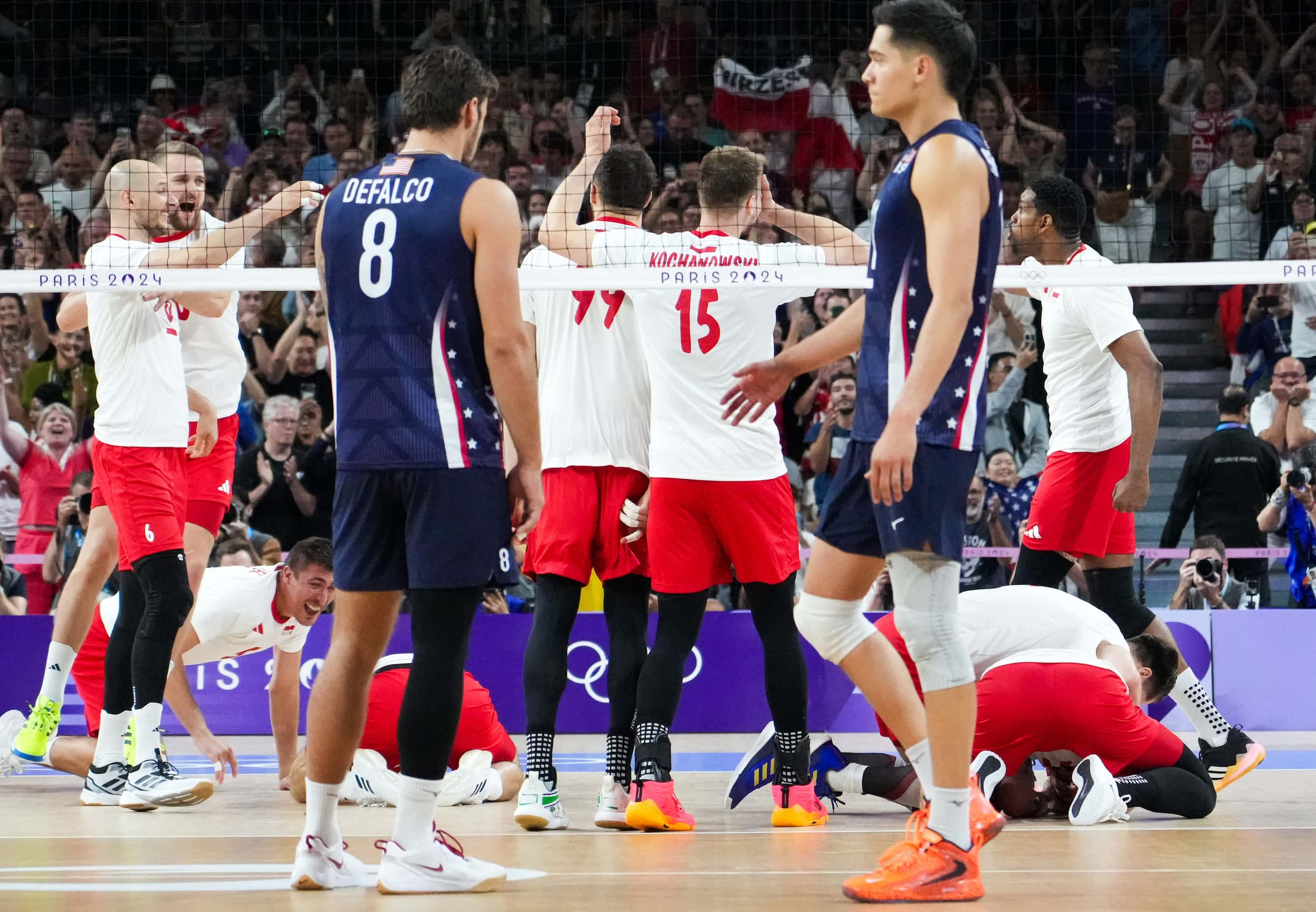 Torey Defalco (8) and Micah Christenson (11) of the United States look on as Team Poland...