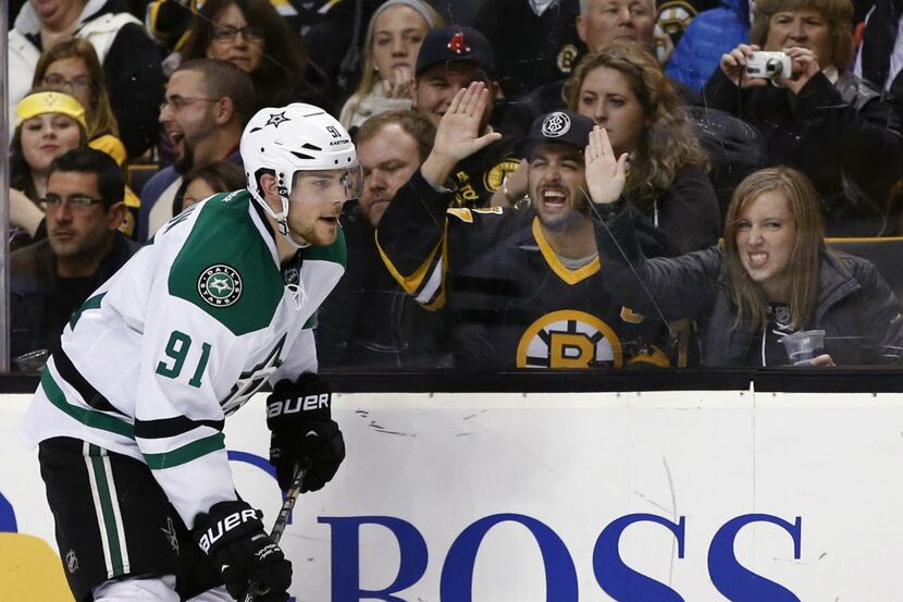 Fans taunt former Boston Bruin and current Dallas Stars center Tyler Seguin (91) during the...