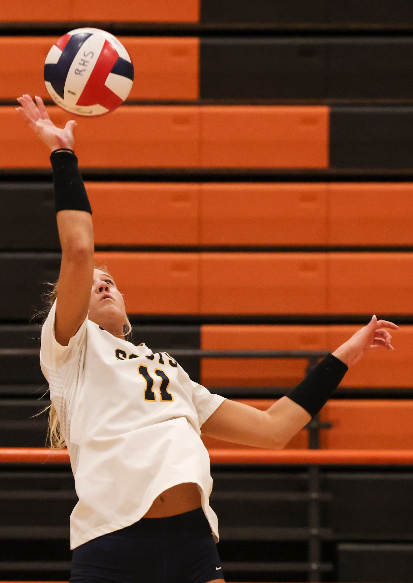 Highland Park High School’s Sydney Breon spikes the ball during the volleyball game between...