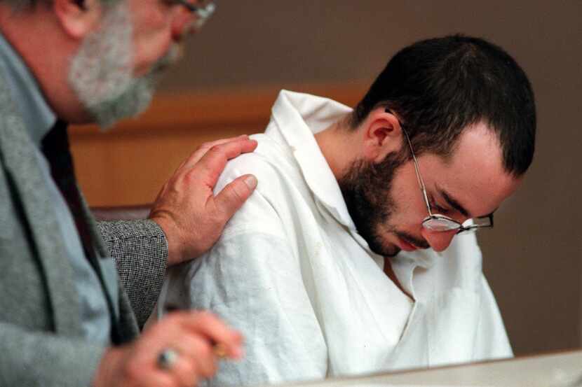 Jedidiah Isaac Murphy is comforted by his attorney, public defender Mike Byck, during...