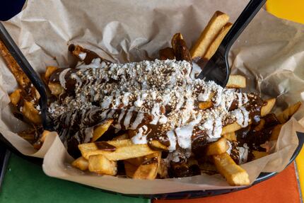 Jesus Carmona's mole fries are beloved. He'll serve them at the State Fair of Texas for the...