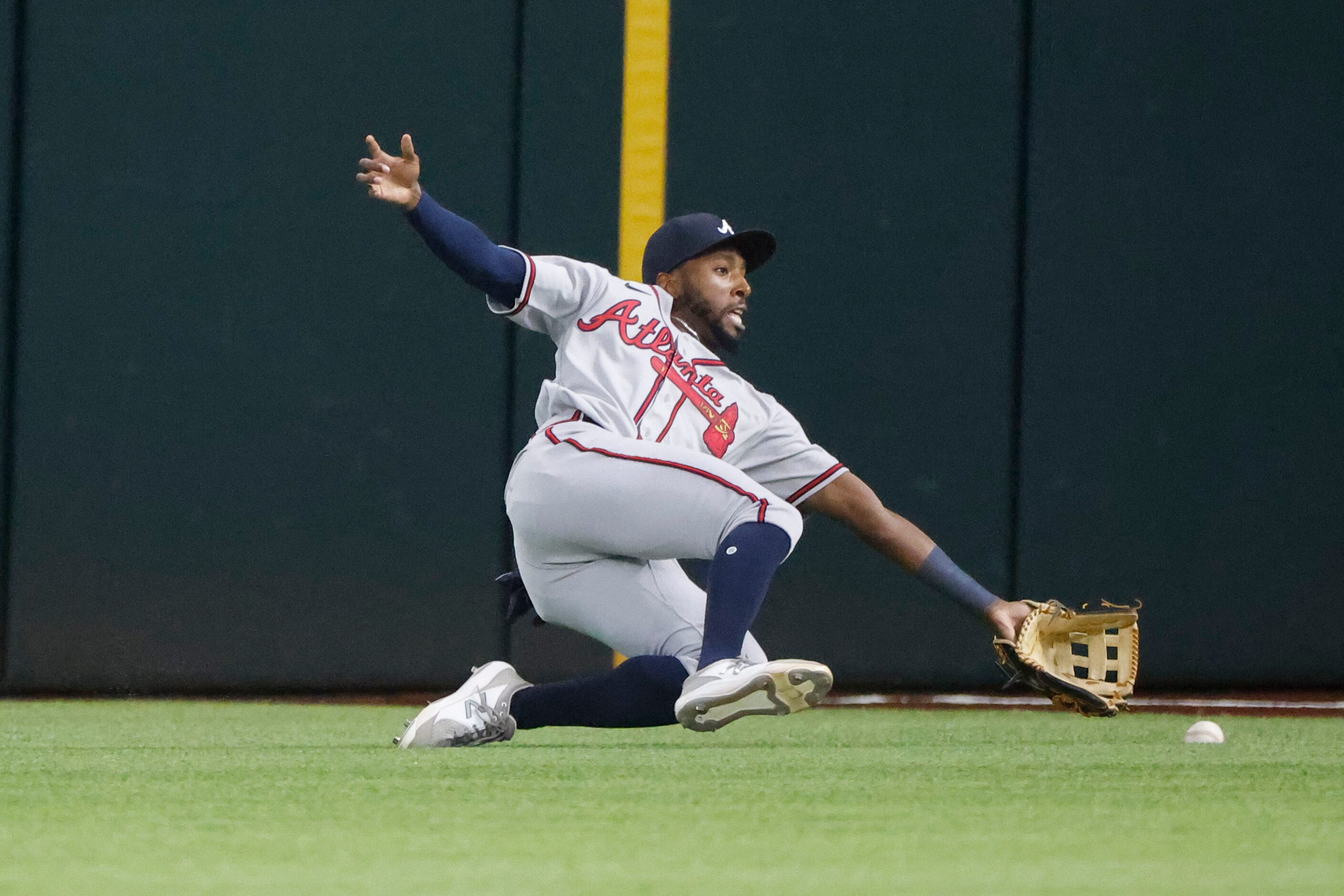 Atlanta Braves right fielder Travis Demeritte (48) fails to catch a hit by Texas Rangers...