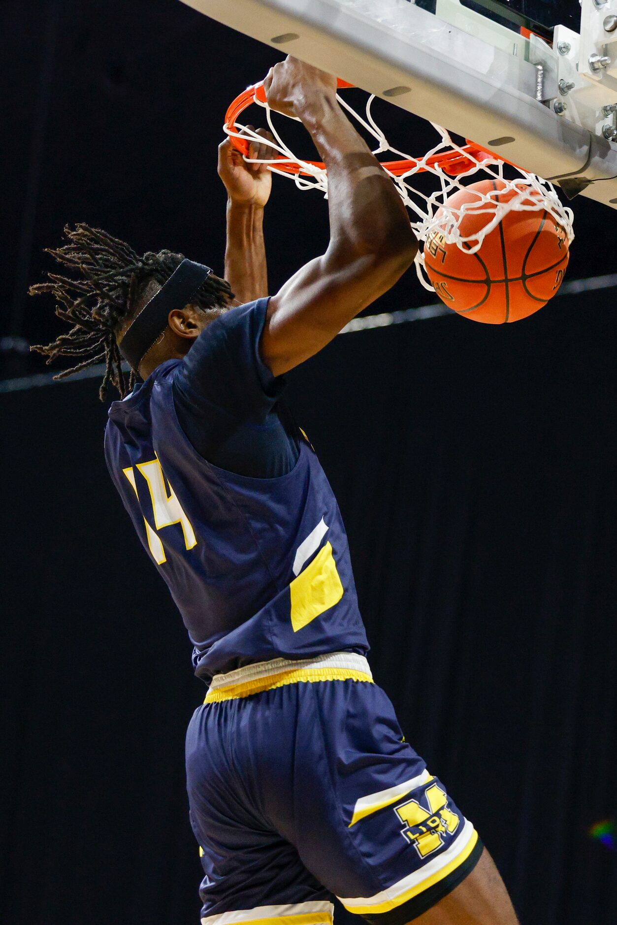 McKinney guard Alex Anamekwe (14) dunks the ball as time expires in double overtime to win...