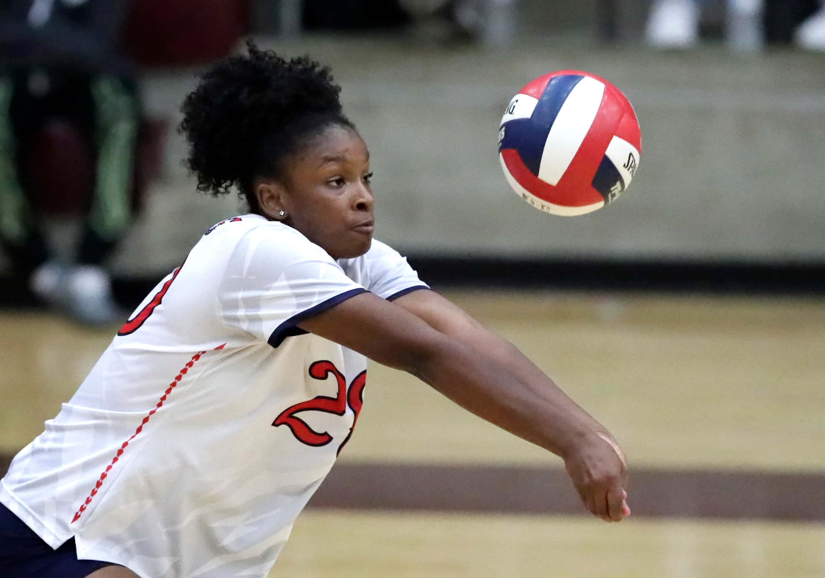 Centennial High School outside hitter Brianna Hamilton (20) receives serve during game one...