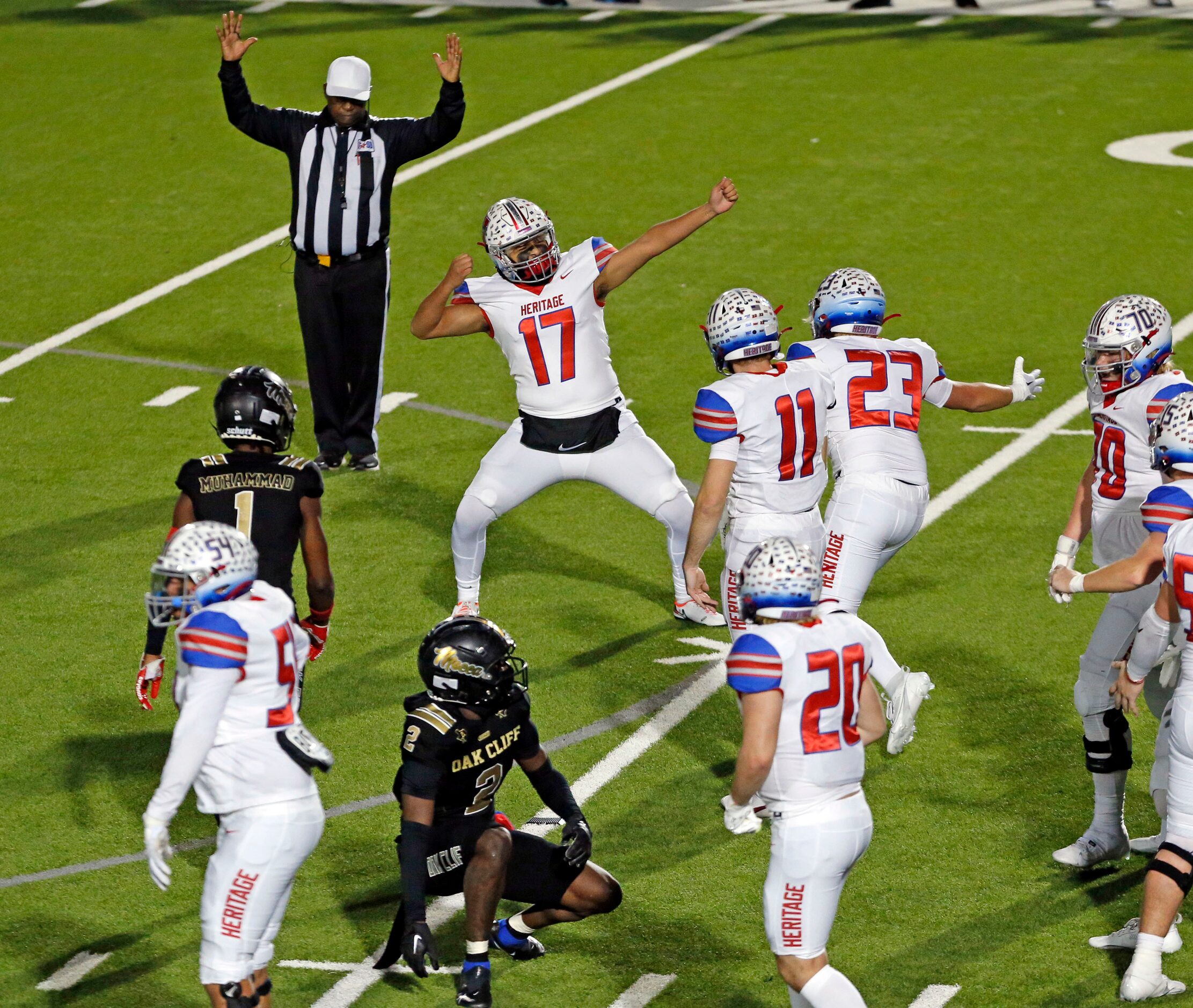 Midlothian Heritage high kicker Jordan Soto (17) strikes an archers pose, as he celebrates...