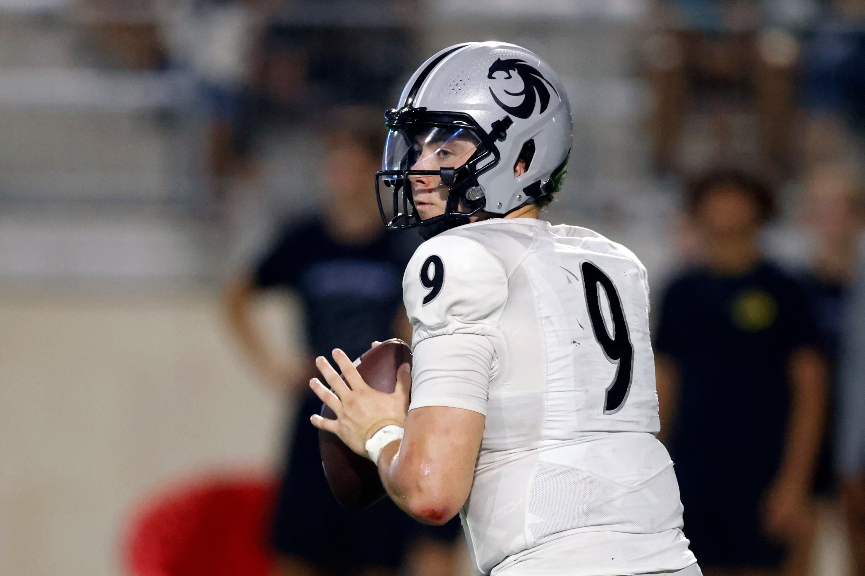 Denton Guyer quarterback Kevin Sperry (9) drops back to pass during the second half of a...