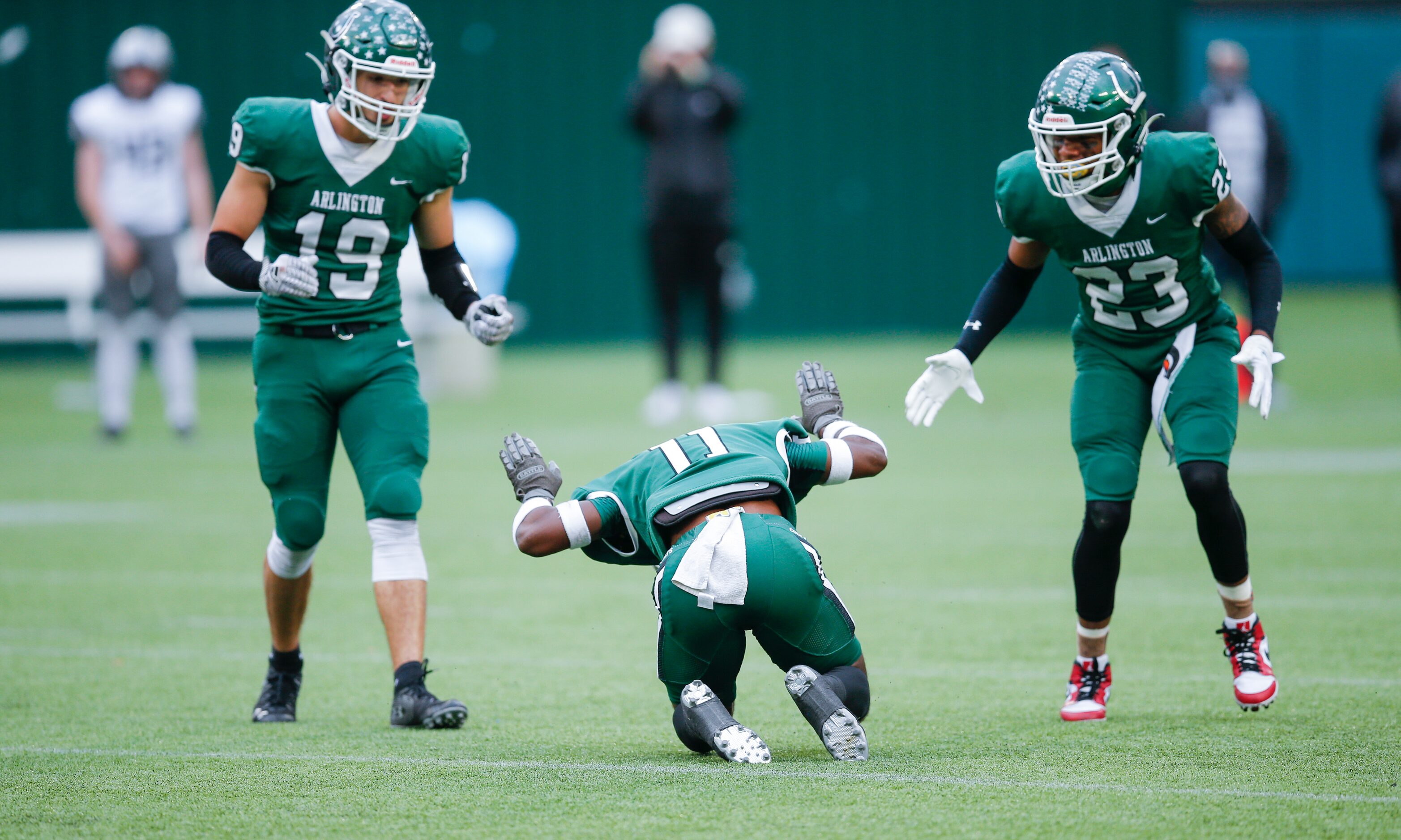 Arlington senior cornerbacks Landon Frye (19) and Richard Toney Jr. (23) look on as senior...