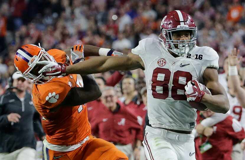 FILE - In this Jan. 11, 2016, file photo, Alabama's O.J. Howard tries to get past Clemson's...
