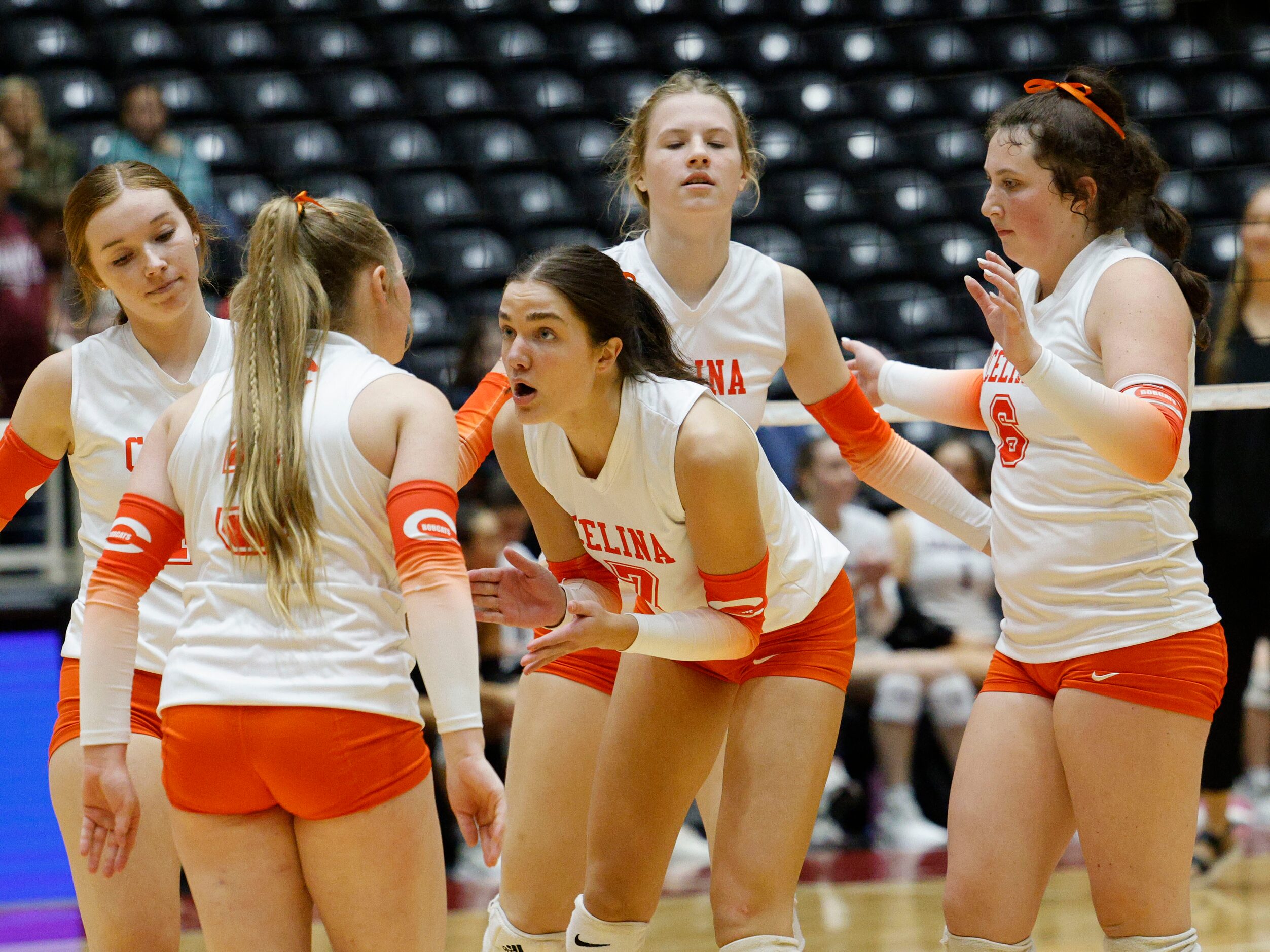 Celina's Ryan McCoy (7), center, talks with Celina's Kinley Hammons (3), left, during a UIL...