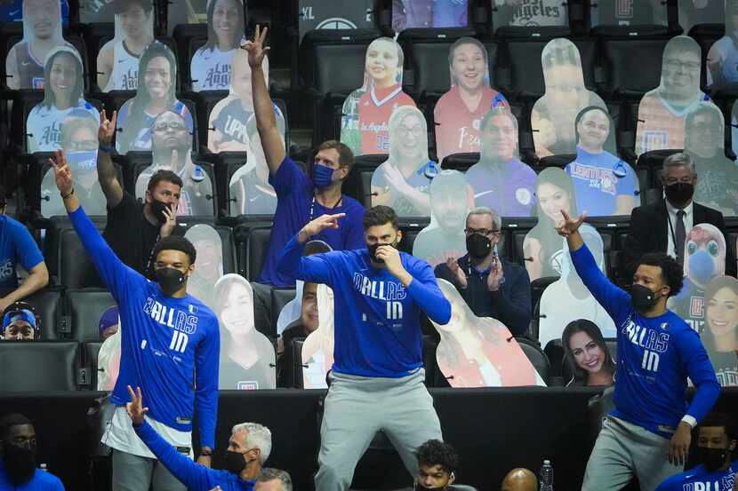 Dallas Mavericks great Dirk Nowitzki (top) celebrates a baskets by forward Tim Hardaway Jr....