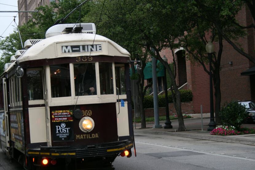 Matilda, a McKinney Avenue Trolley, rides past on the streets of Uptown. (File)
