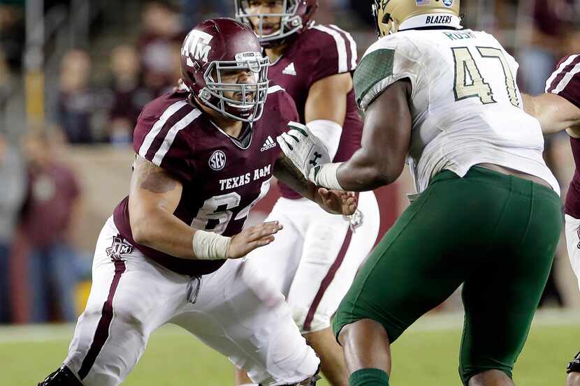 Texas A&M center Erik McCoy (64) blocks UAB defensive lineman Anthony Rush (47) during the...