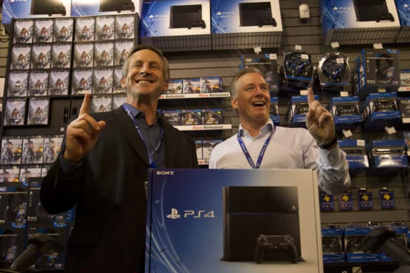 Tony Bartel, president of GameStop Corp., left, and Tim Bender, senior vice president of...