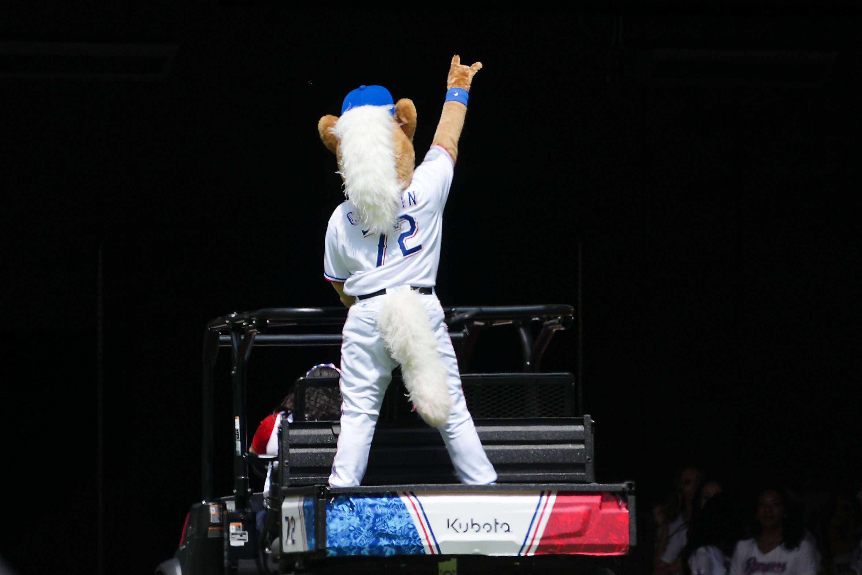 Texas Rangers mascot The Captain points to the crowd before the home opener against the...