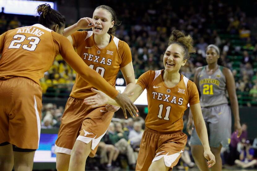 FILE - In this Feb. 6, 2017, file photo, Texas guard Brooke McCarty (11) celebrates with...