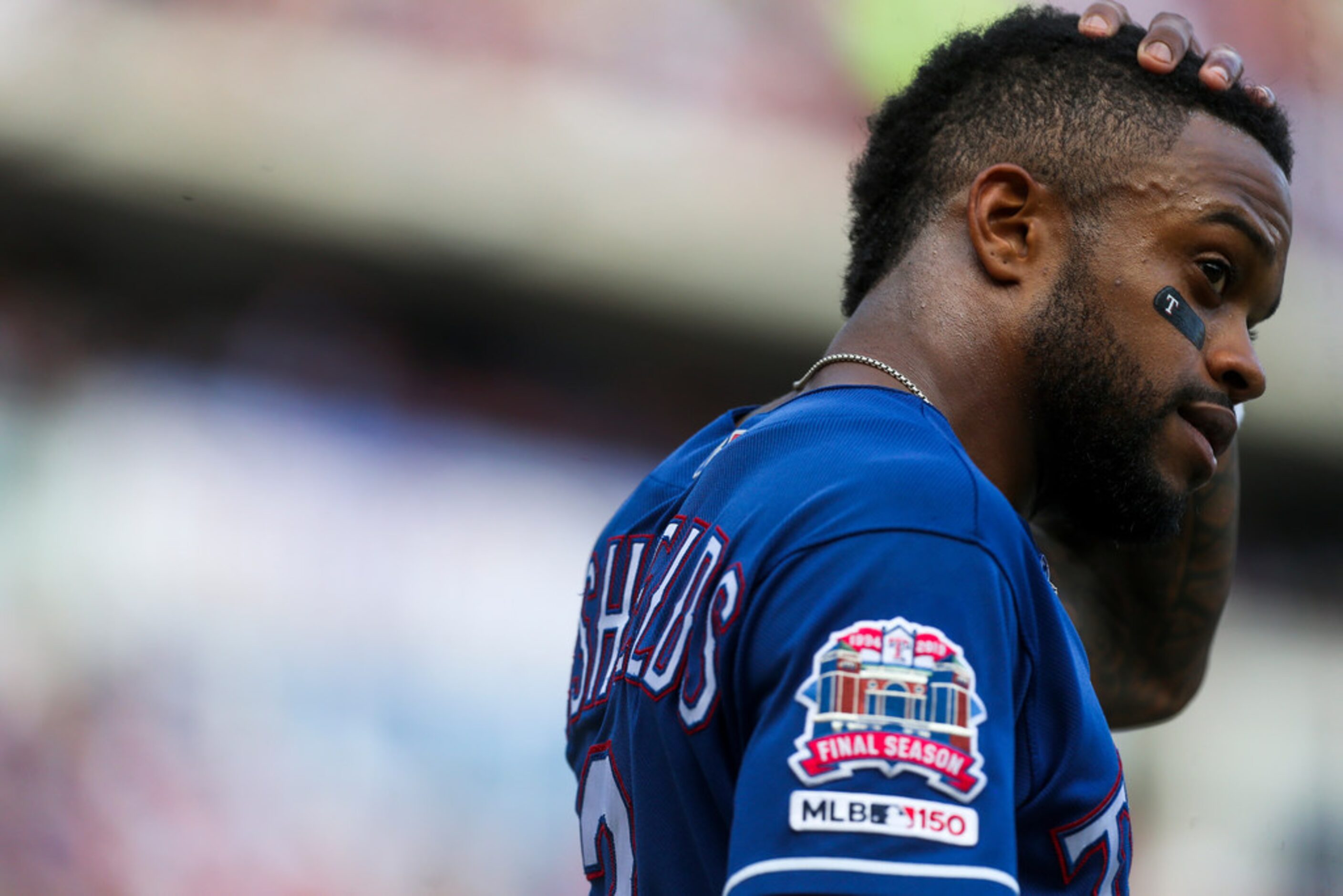 Texas Rangers center fielder Delino DeShields (3) reacts after striking out during a MLB...