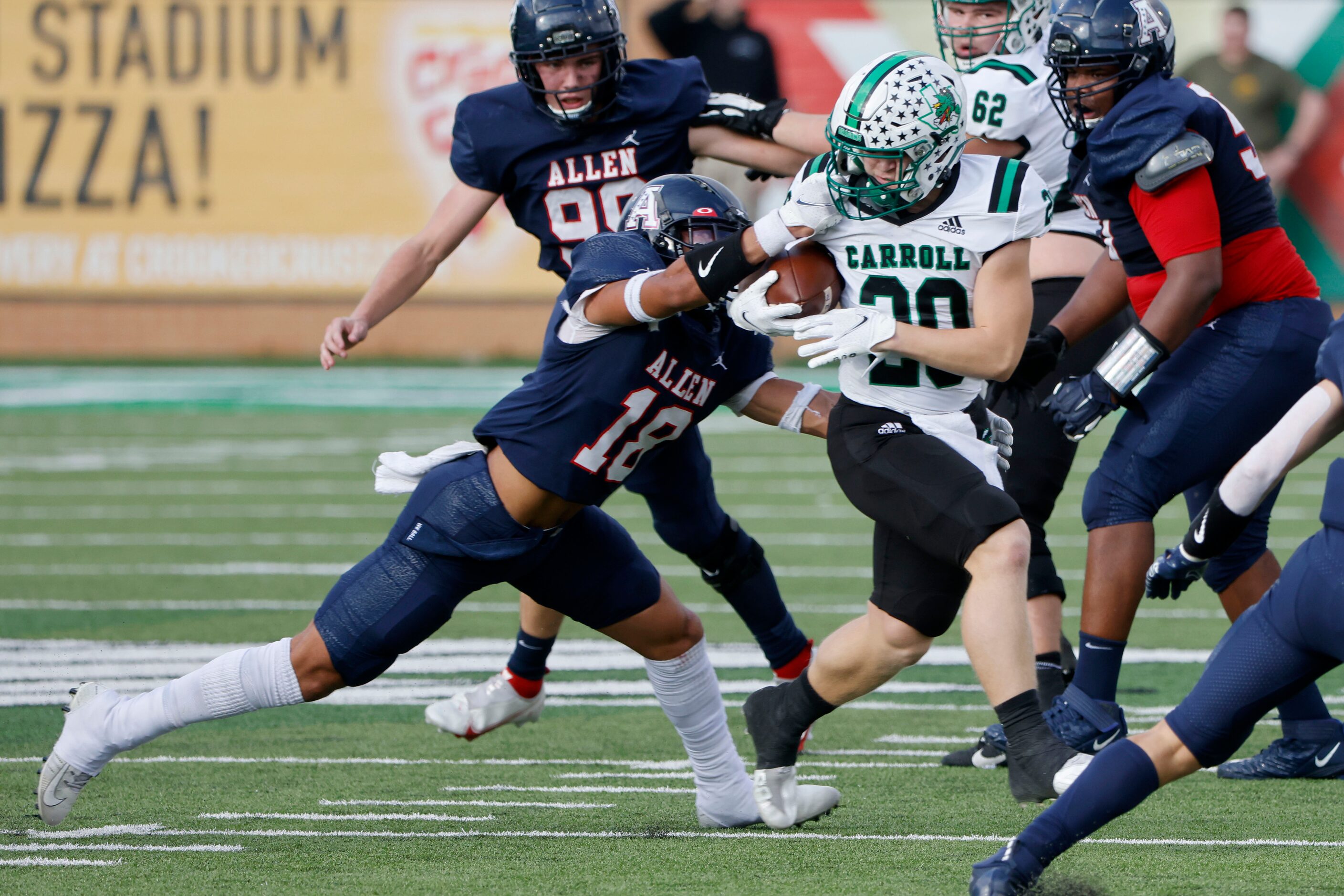 Allen’s Malakai Thornton (18) is called for a facemask penalty against Southlake Carroll’s...