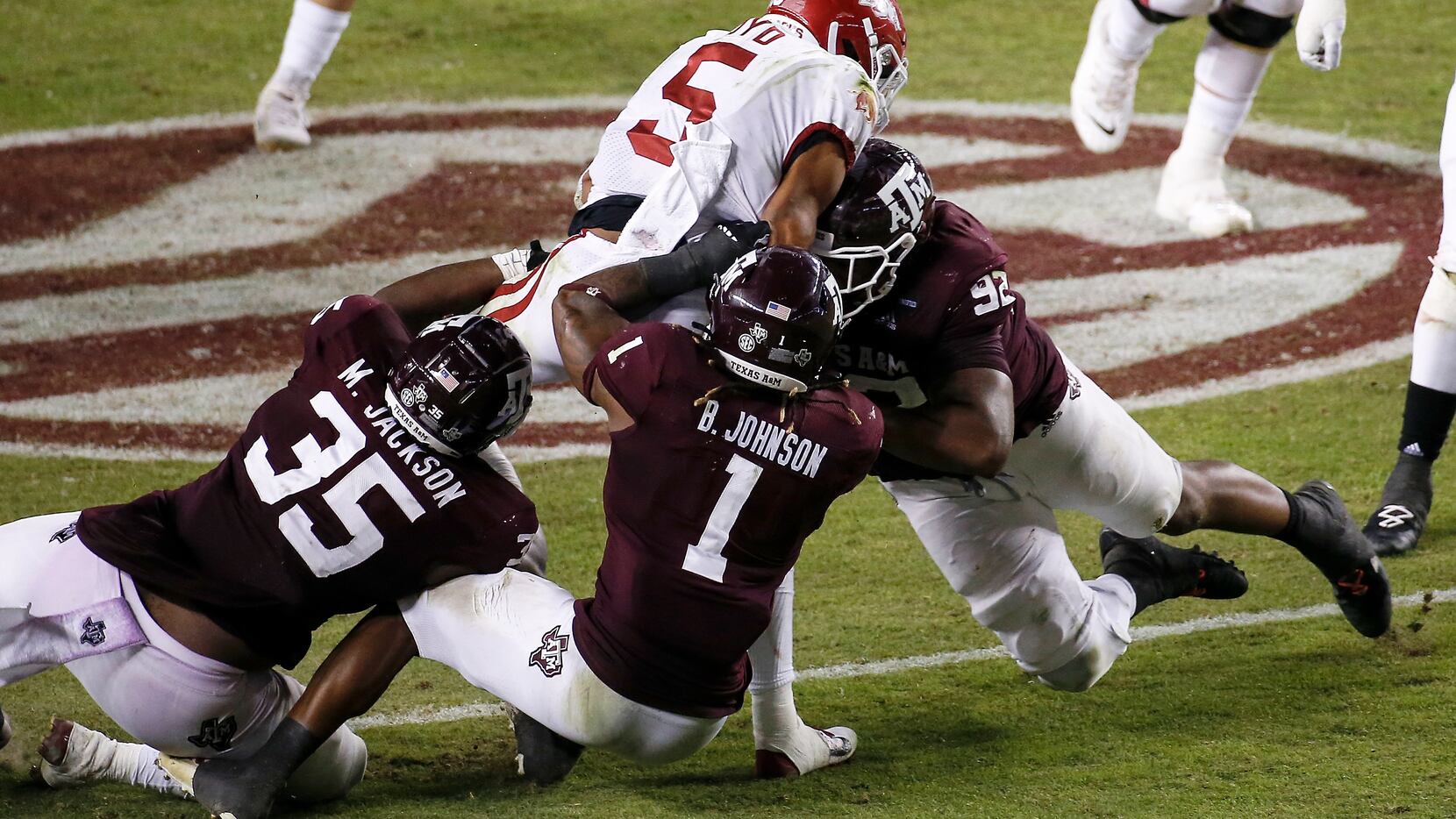 COLLEGE STATION, TEXAS - OCTOBER 31: Rakeem Boyd #5 of the Arkansas Razorbacks is tackled by...