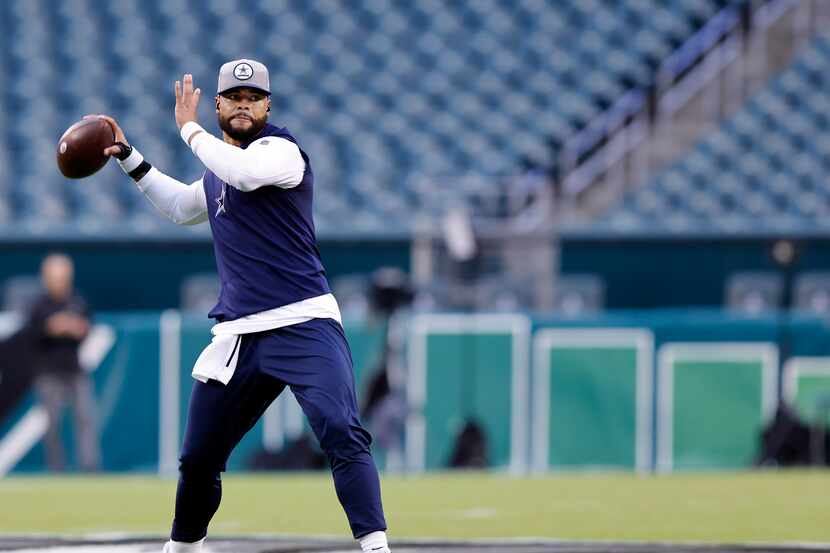 Dallas Cowboys quarterback Dak Prescott practices his throwing during pregame warmups at...